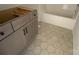 Under construction bathroom with gray vanity and hexagon tile floor at 1017 Wandsworth Pl # Ken0108, Charlotte, NC 28215