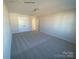 Spacious bedroom with neutral gray carpet and double doors at 1017 Wandsworth Pl # Ken0108, Charlotte, NC 28215