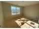 Unfinished bedroom with large window and hardwood floor at 1017 Wandsworth Pl # Ken0108, Charlotte, NC 28215