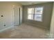 Bright bedroom with double doors and a large window at 1017 Wandsworth Pl # Ken0108, Charlotte, NC 28215