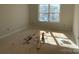 Simple bedroom with large window and wood flooring at 1017 Wandsworth Pl # Ken0108, Charlotte, NC 28215