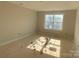 Unfinished bedroom with large window and wood flooring at 1017 Wandsworth Pl # Ken0108, Charlotte, NC 28215