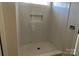 Clean shower with marble-style tile and built-in niche at 1017 Wandsworth Pl # Ken0108, Charlotte, NC 28215