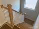 Simple staircase with light wood railing and white balusters at 1017 Wandsworth Pl # Ken0108, Charlotte, NC 28215