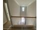 View of upstairs hallway with open railing overlooking the foyer at 1017 Wandsworth Pl # Ken0108, Charlotte, NC 28215