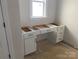 Unfinished vanity with white cabinets and drawers at 1017 Wandsworth Pl # Ken0108, Charlotte, NC 28215