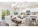 Dining area featuring hardwood floors, a chandelier, and sliding glass doors overlooking greenery at 1027 Freeman View Dr # 151P, Albemarle, NC 28001