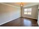 Bright bedroom with a large window and stylish light fixture at 126 E Northstone Rd, Mooresville, NC 28115