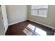 Bedroom with hardwood floors, a window and white painted walls at 126 E Northstone Rd, Mooresville, NC 28115