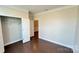 Bedroom with hardwood floors, crown molding, and closet at 126 E Northstone Rd, Mooresville, NC 28115