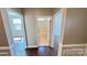 Hallway view featuring dark hardwood floors and doors to other rooms at 126 E Northstone Rd, Mooresville, NC 28115