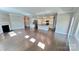 Spacious living room adjacent to the kitchen, featuring hardwood floors and fireplace at 126 E Northstone Rd, Mooresville, NC 28115