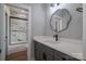 Bathroom featuring gray cabinets, solid countertop, and walk-in marble tiled shower at 229 Golf Course Rd, Maiden, NC 28650