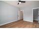 Bedroom features hardwood floors, gray walls and a hallway to a walk-in closet at 229 Golf Course Rd, Maiden, NC 28650