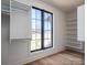 A walk-in closet with natural light and shelving for storage at 229 Golf Course Rd, Maiden, NC 28650