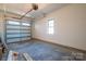 An empty two car garage featuring a window and an insulated garage door at 229 Golf Course Rd, Maiden, NC 28650