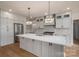 Modern kitchen with a large island, stainless steel appliances, and custom cabinetry at 229 Golf Course Rd, Maiden, NC 28650