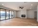 Open-concept living room with fireplace and a large sliding doors lead to an outdoor deck at 229 Golf Course Rd, Maiden, NC 28650