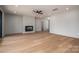 Bright living room featuring hardwood floors and a fireplace at 229 Golf Course Rd, Maiden, NC 28650