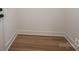 An empty walk-in closet with vinyl floor at 229 Golf Course Rd, Maiden, NC 28650