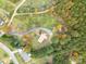 Aerial view of a house with a red roof surrounded by colorful autumn trees at 231 Cheek Rd, Clover, SC 29710