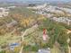 Overhead view of property with a house with a red roof surrounded by colorful autumn trees at 231 Cheek Rd, Clover, SC 29710