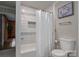 Bathroom with decorative tiles and a shower with white curtain at 231 Cheek Rd, Clover, SC 29710