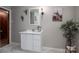 Bathroom featuring modern vanity with drawers, a decorative mirror and houseplants at 231 Cheek Rd, Clover, SC 29710