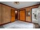 Bedroom with wood-look walls and a closet with wooden doors at 231 Cheek Rd, Clover, SC 29710