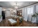 Dining room with hardwood floors, white curtains, and view to the kitchen at 231 Cheek Rd, Clover, SC 29710