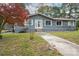 Charming home exterior featuring grey siding, a red roof, and a well-maintained yard at 231 Cheek Rd, Clover, SC 29710