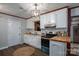 Charming kitchen featuring white cabinetry, wood countertops and modern lighting at 231 Cheek Rd, Clover, SC 29710