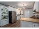 Bright kitchen featuring white cabinets, stainless steel appliances, and butcher block countertop at 231 Cheek Rd, Clover, SC 29710