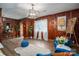 Bright living room with wood-paneled walls, hardwood floors, and natural light at 231 Cheek Rd, Clover, SC 29710