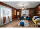 Inviting living room with hardwood floors, wood-paneled walls and natural light at 231 Cheek Rd, Clover, SC 29710