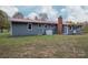 Gray house with red roof, brick chimney, and green lawn at 231 Cheek Rd, Clover, SC 29710