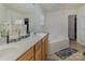 Bathroom featuring double sinks, white countertops, and a soaking tub at 2512 Holly Oak Ln, Gastonia, NC 28056