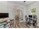 Bright bedroom featuring a desk and access to dining room through white french doors at 2512 Holly Oak Ln, Gastonia, NC 28056