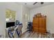 Bright bedroom featuring a wooden armoire, a desk, and two windows with lots of natural light at 2512 Holly Oak Ln, Gastonia, NC 28056