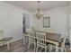 Traditional dining room with chandelier and neutral colors, adjacent to the kitchen at 2512 Holly Oak Ln, Gastonia, NC 28056