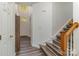 Welcoming foyer features modern gray flooring leading to stairs with wood accents at 2512 Holly Oak Ln, Gastonia, NC 28056