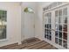 Bright foyer with a white front door, a transom window, and decorative French doors at 2512 Holly Oak Ln, Gastonia, NC 28056