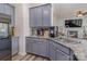 Modern kitchen with gray cabinets, granite countertops, stainless steel sink and appliances at 2512 Holly Oak Ln, Gastonia, NC 28056