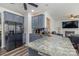 Well-appointed kitchen featuring granite countertops, grey cabinets, and stainless steel appliances at 2512 Holly Oak Ln, Gastonia, NC 28056