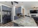 Well-appointed kitchen featuring granite countertops, grey cabinets, and stainless steel appliances at 2512 Holly Oak Ln, Gastonia, NC 28056