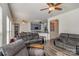 Comfortable living room featuring two sofas and an open layout connected to the kitchen at 2512 Holly Oak Ln, Gastonia, NC 28056