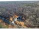 Stunning aerial view of the secluded home surrounded by lush forest and a paved driveway at 6630 Vesuvius Furnace Rd # 1, Denver, NC 28037