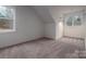 Neutral-toned bedroom featuring plush carpeting and ample natural light from large windows at 6630 Vesuvius Furnace Rd # 1, Denver, NC 28037