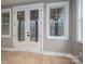 Close up of french doors leading to a porch with wooded views, and a window at 6630 Vesuvius Furnace Rd # 1, Denver, NC 28037