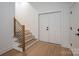 Bright entryway featuring hardwood floors, and stairs with modern railings at 6630 Vesuvius Furnace Rd # 1, Denver, NC 28037